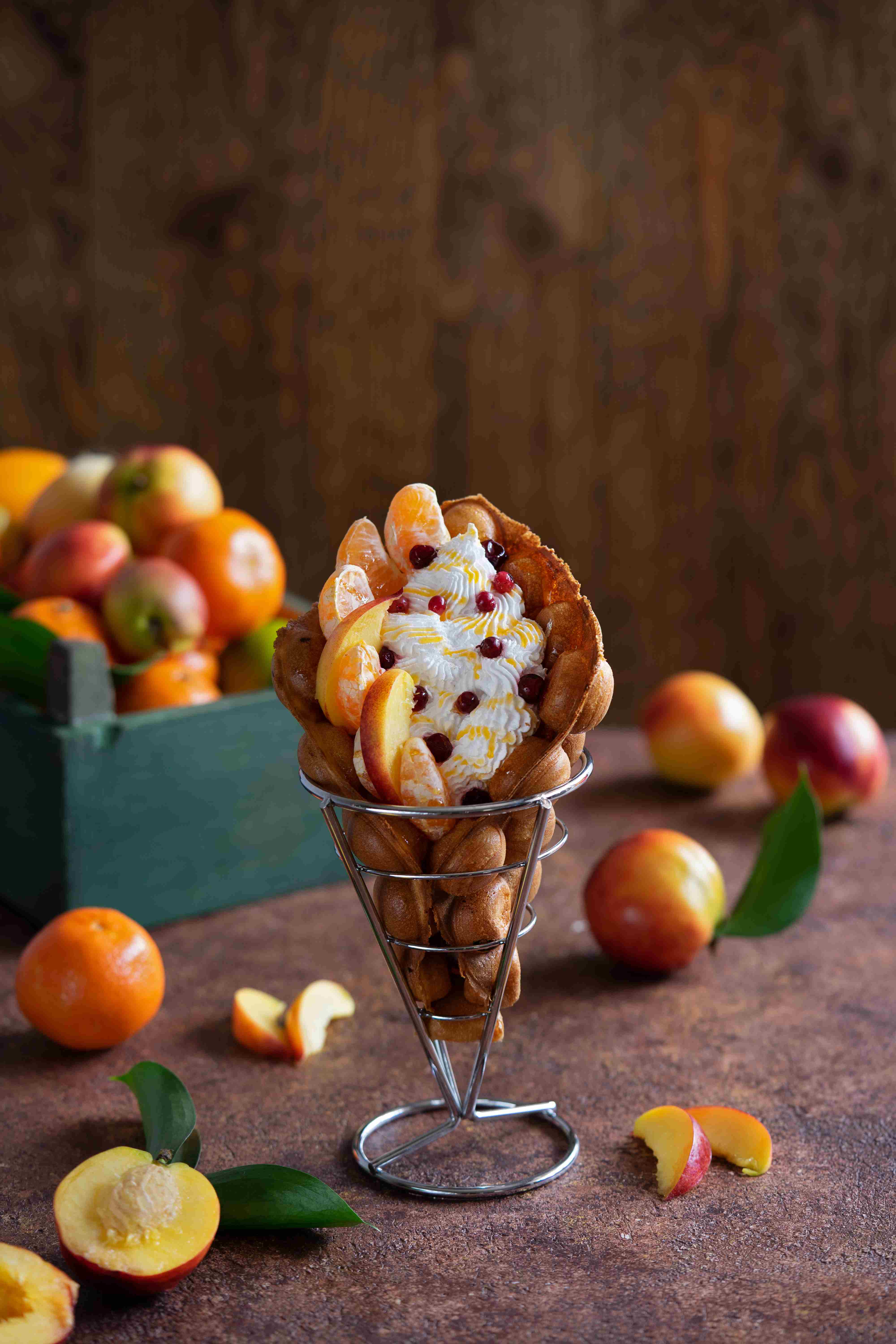 hong-kong-bubble-waffles-stuffed-with-whipped-cream-peach-slices.jpg