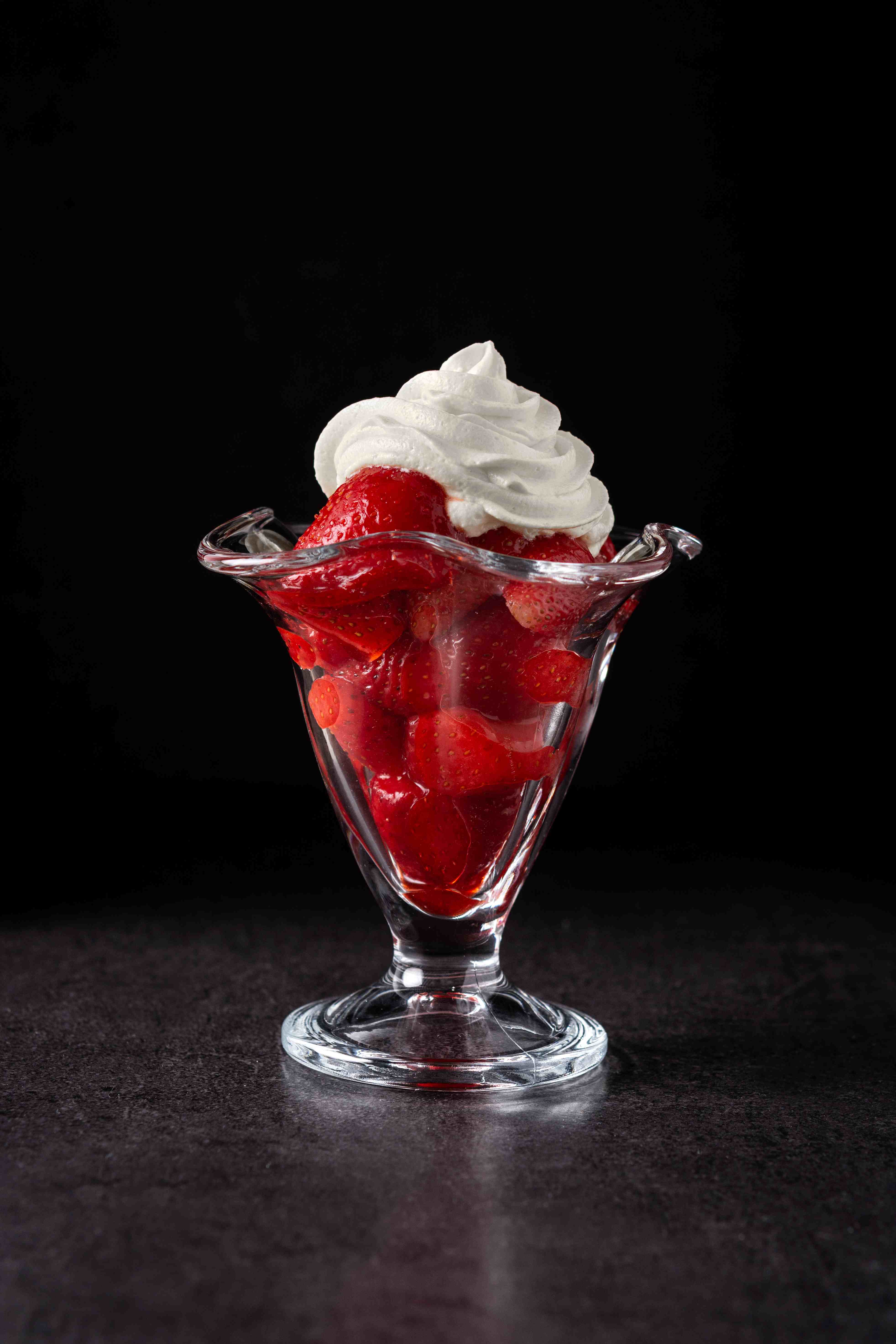 strawberries-whipped-cream-ice-cream-glass-black-background.jpg