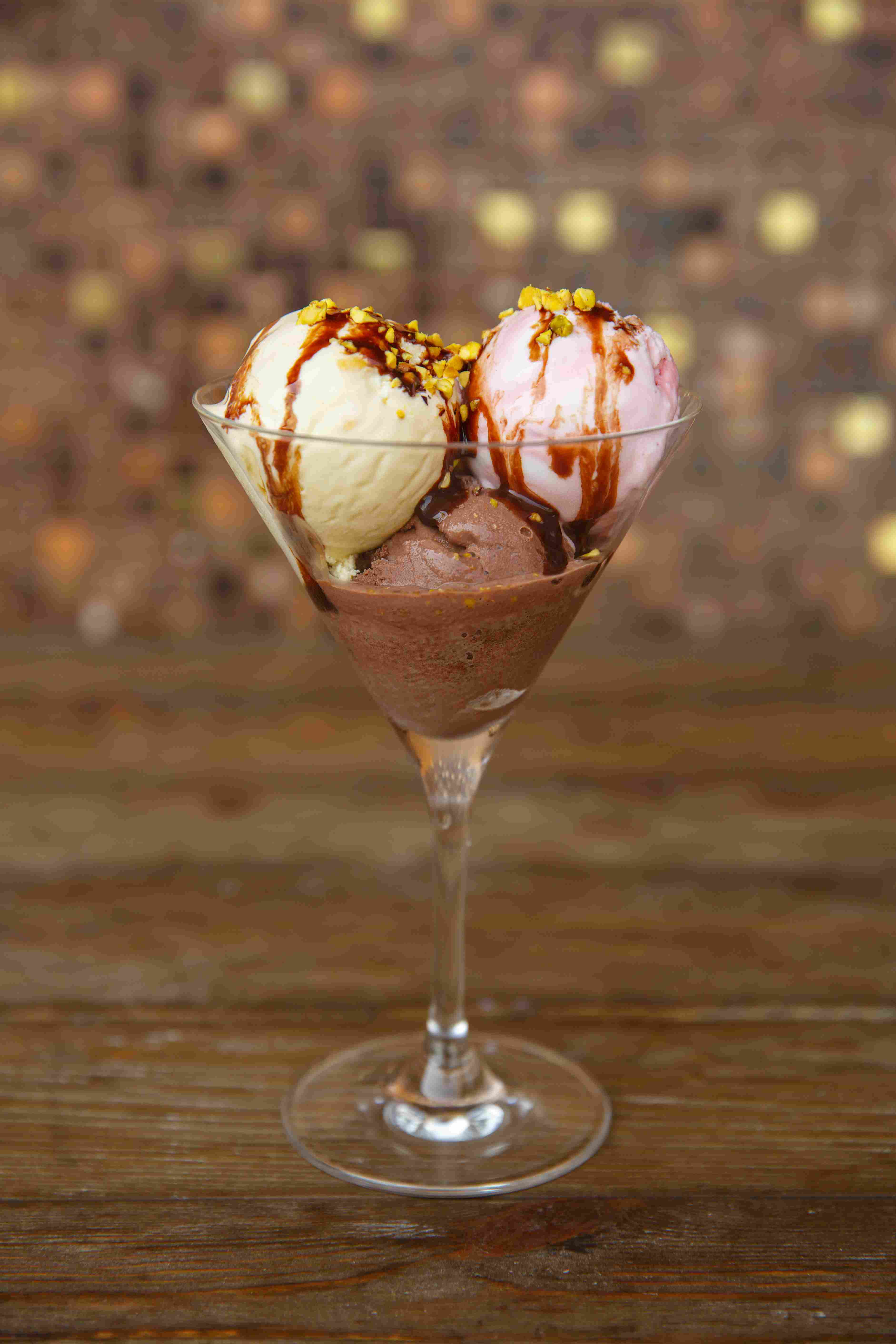 three-ice-cream-balls-wit-strawberry-vanilla-coffee-covered-with-chocolate-syrup.jpg