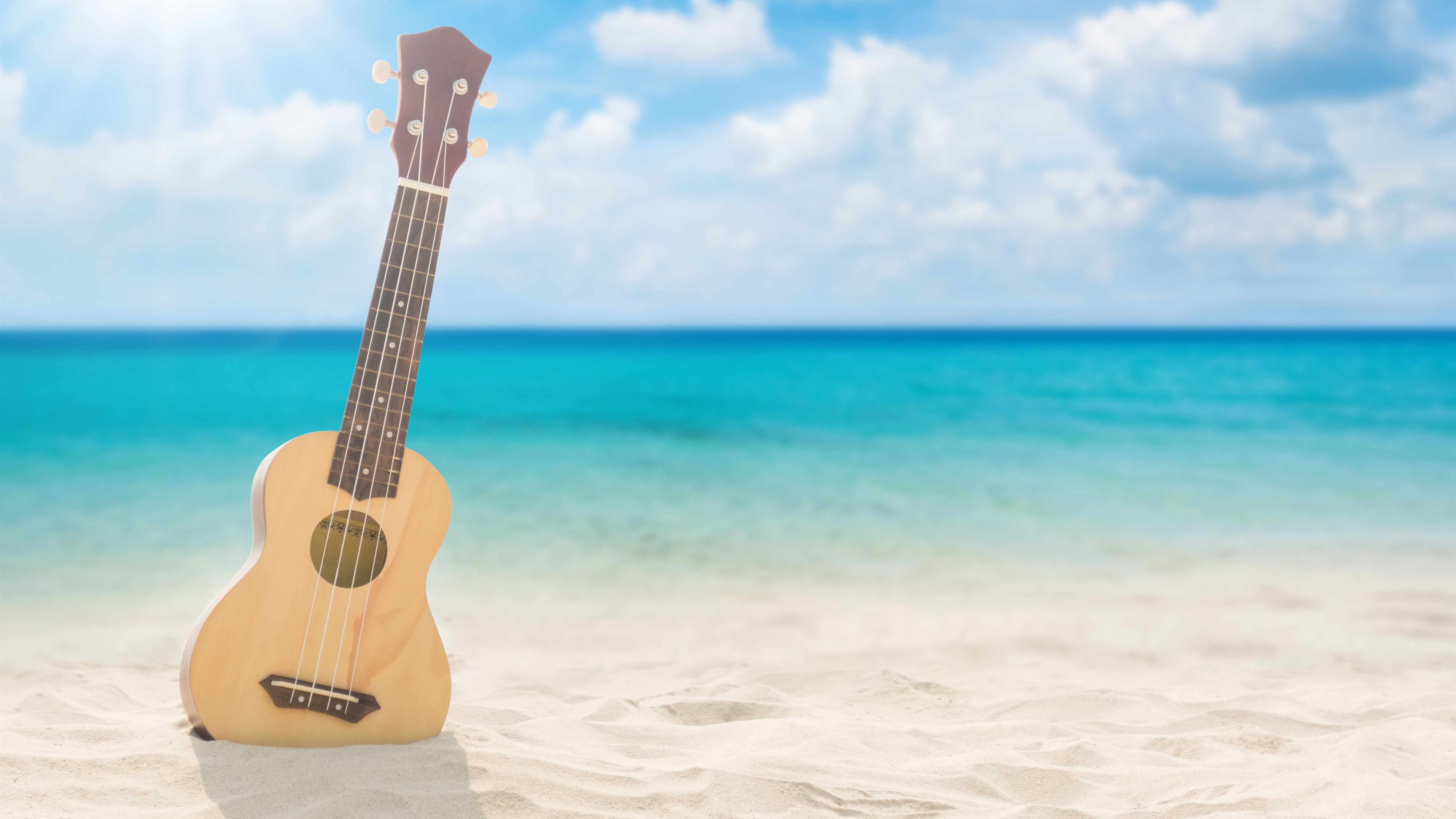 Guitar-beach-sea-clouds-sunshine_5120x2880.jpg