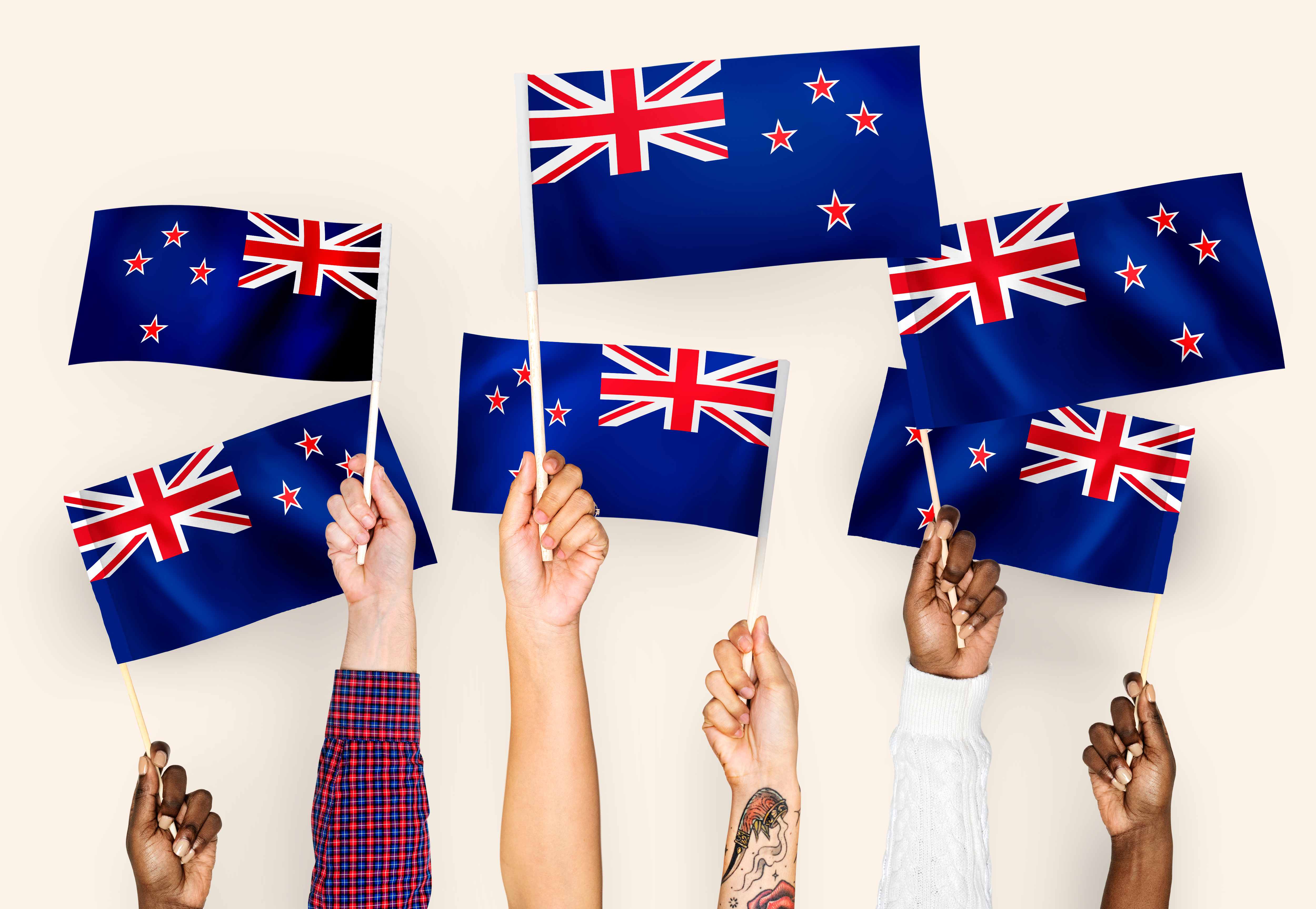hands-waving-flags-of-new-zealand.jpg
