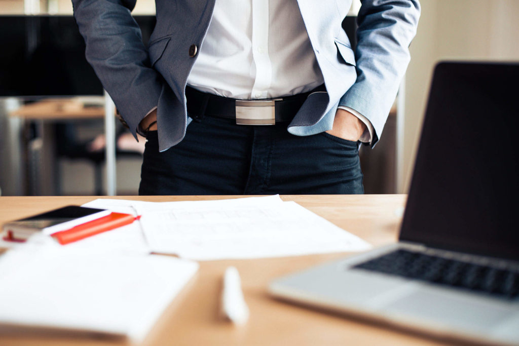 businessman-standing-in-his-office-2210x1473-1-1024x683.jpg